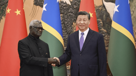 Solomon Islands Prime Minister Manasseh Sogavare (left) meets with Chinese President Xi Jinping last week in Beijing.