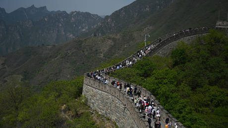 People climb the Great Wall of China at Mutianyu, north of Beijing, on the Labor Day holiday on May 1, 2023.