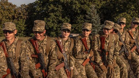 Ukrainian cadets wait before a ceremony for taking the military oath at The National Museum of the History of Ukraine in WWII in Kiev, on September 8, 2023.