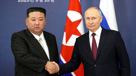 Russian President Vladimir Putin shakes hands with President of the State Affairs Commission of North Korea Kim Jong-un