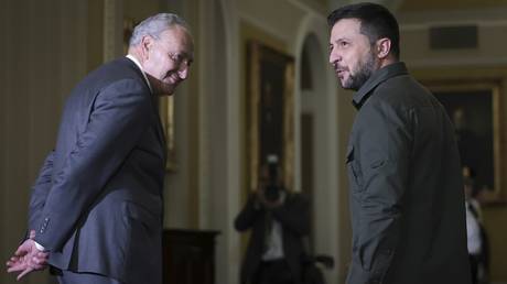 US Senate Majority Leader Chuck Schumer walks with Ukrainian President Vladimir Zelensky at the Capitol Building, on September 21, 2023