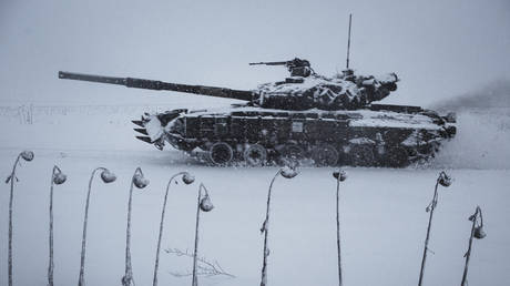 FILE PHOTO. A Ukrainian tank moves on a snow covered road.