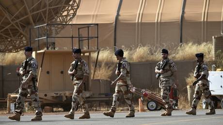 French soldiers walk at Air Base 101in Niamey, Niger, November 23, 2014