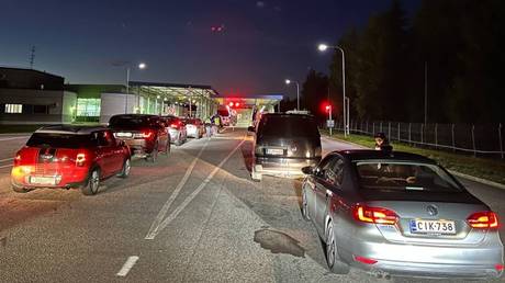FILE PHOTO: Cars queue to enter Finland from Russia at the Brusnichnoye multilateral automobile checkpoint.